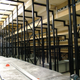 This view underneath the tiering in a large lecture theatre shows the support structure and underfloor services.